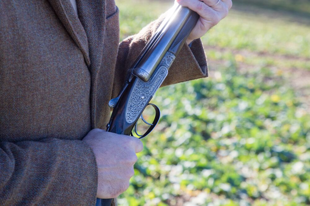 Tweed jacket and shotgun